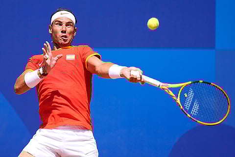 Rafael Nadal slams a forehand to Serbia's Novak Djokovic